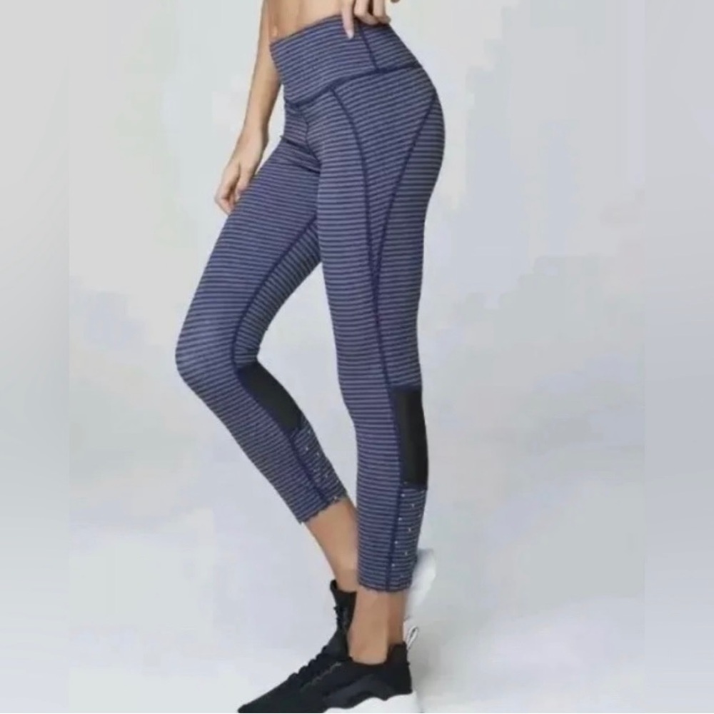 Varley striped downing tight- mesh insert leggings.